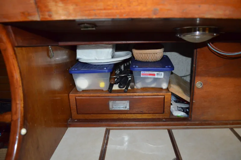 Slide: The Image of Interior of 1963 Hinckley Bermuda 40 with storage and containers. - 20