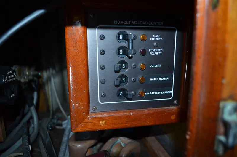 Slide: The Image of Hinckley Bermuda 40 1963 electrical panel with breakers and switches. - 26