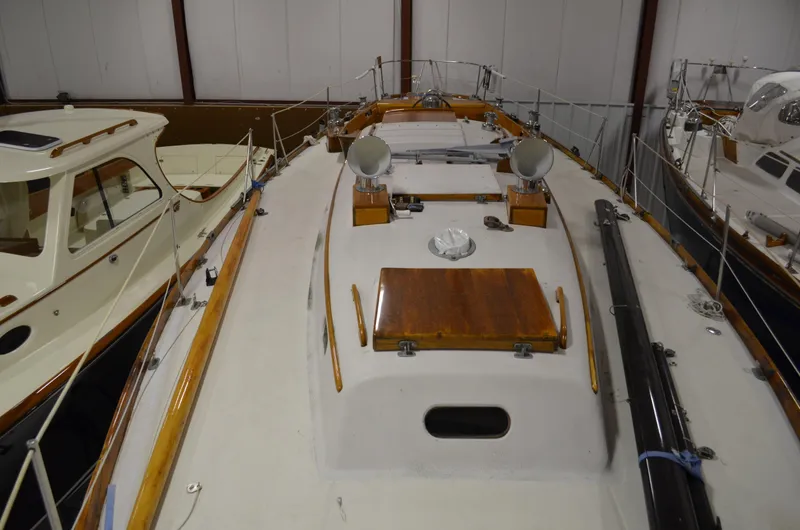 Slide: The Image of 1963 Hinckley Bermuda 40 sailboat in storage warehouse. - 37