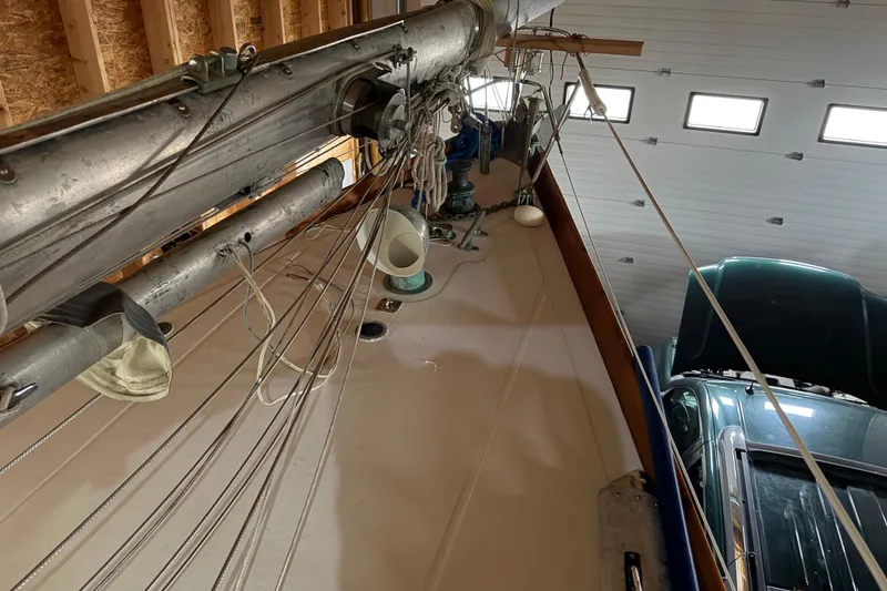 Slide: The Image of Hinckley Bermuda 40 sailboat mast and rigging in a garage, 1963 model. - 40