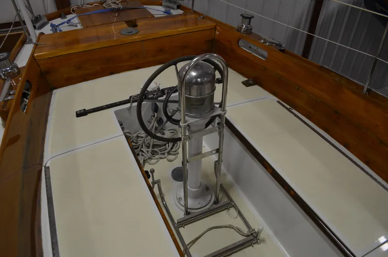 Slide: The Image of Cockpit of a 1963 Hinckley Bermuda 40 yacht with steering wheel. - 46