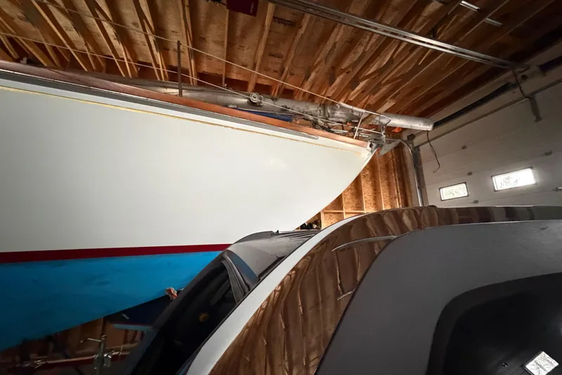 Slide: The Image of Hinckley Bermuda 40 sailboat from 1963 stored in a wooden garage. - 56