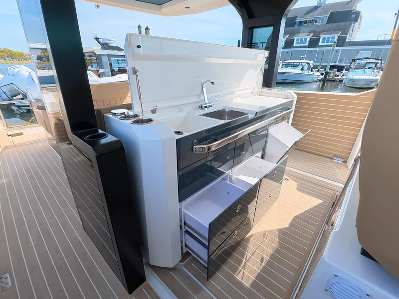 Slide: The Image of The 2027 Saxdor 400 GTS features a modern outdoor kitchen with a sink and storage. - 18