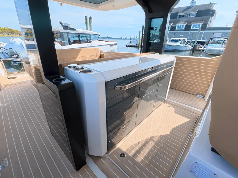 Slide: The Image of The image shows the deck of a 2027 Saxdor 400 GTS with sleek wood flooring and modern features. - 17