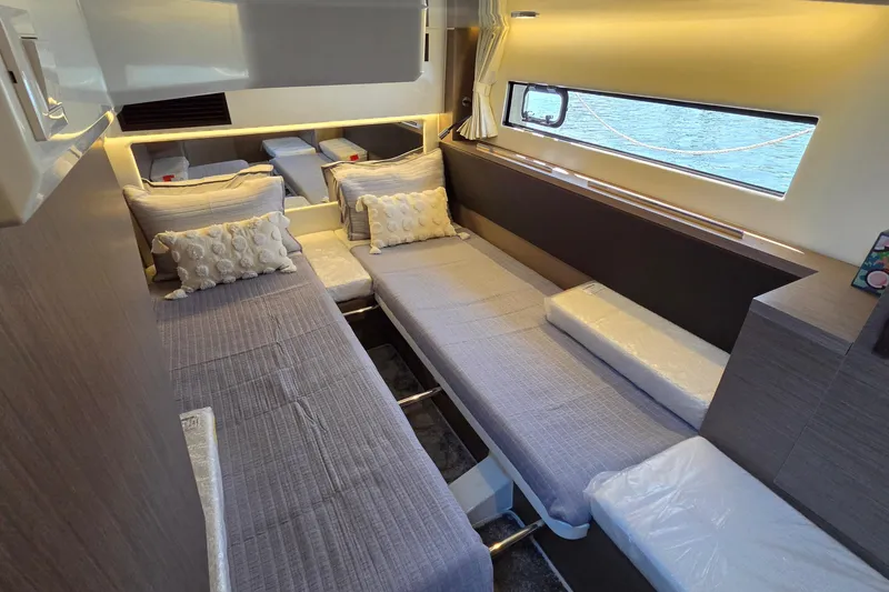 Slide: The Image of Luxurious interior cabin of 2024 Jeanneau NC Weekender 1295 Fly with cozy bedding. - 26