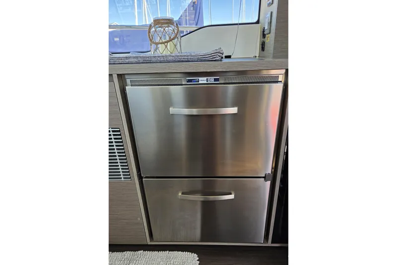 Slide: The Image of Stainless steel refrigerator drawers on 2024 Jeanneau NC Weekender 1295 Fly yacht. - 21