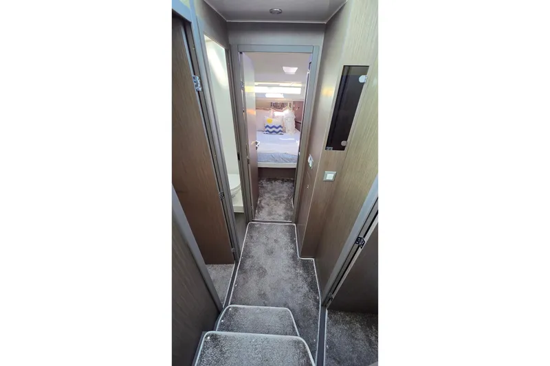 Slide: The Image of Interior hallway of 2024 Jeanneau NC Weekender 1295 Fly, featuring modern design and cozy bedroom. - 22