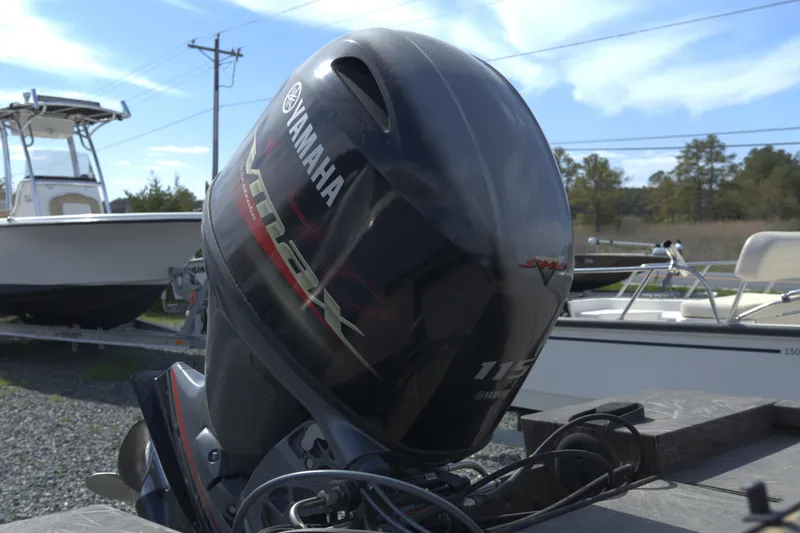 Slide: The Image of Yamaha outboard motor on a 2020 G3 Bay 20 DLX Camo boat, parked outdoors. - 10