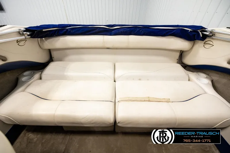 Slide: The Image of Interior seating of a 2001 Crownline 225 BR boat with white upholstery. - 19