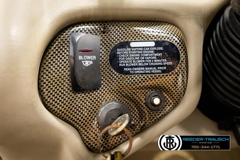 Slide: The Image of 2001 Crownline 225 BR dashboard with blower switch and safety warning label. - 30