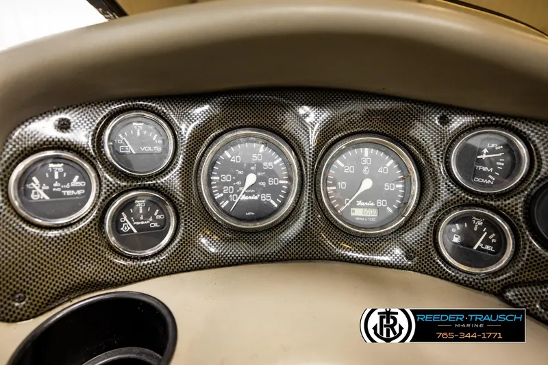 Slide: The Image of Dashboard of a 2001 Crownline 225 BR boat with various gauges and controls. - 31
