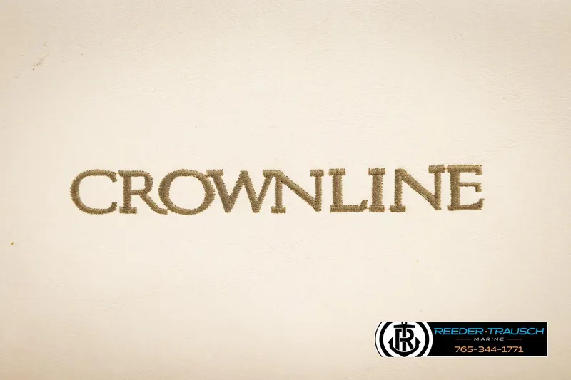 Slide: The Image of Crownline logo on beige background, featuring Reeder-Trausch Marine contact details. - 39