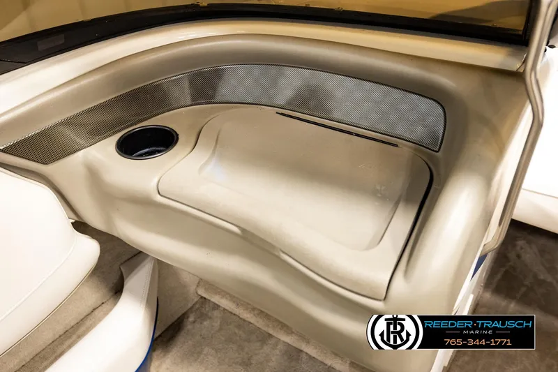 Slide: The Image of Interior of 2001 Crownline 225 BR boat with cup holder and storage compartment. - 40