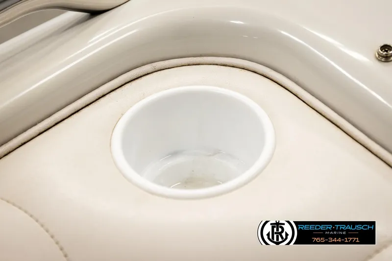 Slide: The Image of Cup holder on 2001 Crownline 225 BR boat interior, featuring beige upholstery. - 41