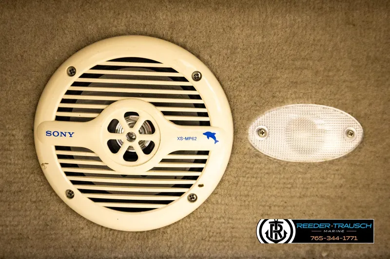 Slide: The Image of Sony speaker and light fixture on a 2001 Crownline 225 BR boat interior. - 42