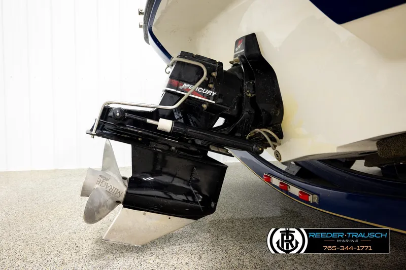 Slide: The Image of Rear view of a 2001 Crownline 225 BR boat with Mercury outboard motor. - 43