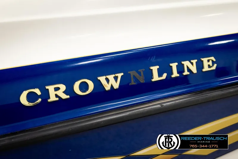 Slide: The Image of 2001 Crownline 225 BR boat logo on blue and white hull. - 48