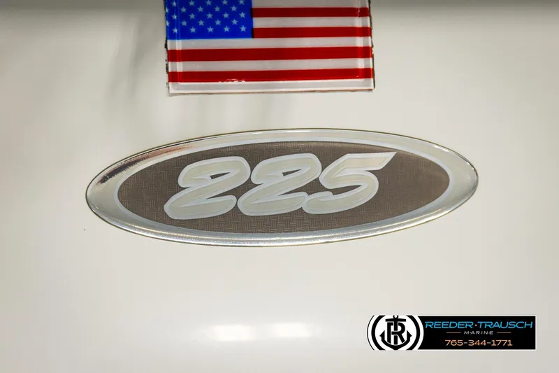 Slide: The Image of Crownline 225 BR 2001 boat emblem with American flag and Reeder-Trausch Marine logo. - 49
