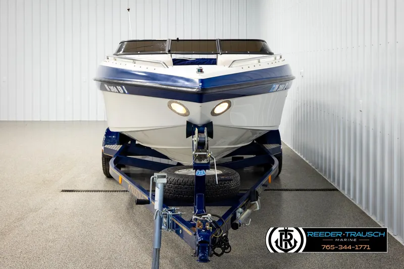Slide: The Image of 2001 Crownline 225 BR boat on trailer in indoor storage facility. - 8