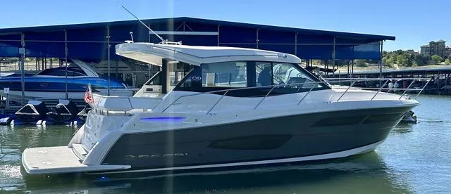 The Image of 2021 Regal 38 Grande Coupe yacht docked at marina. - 1