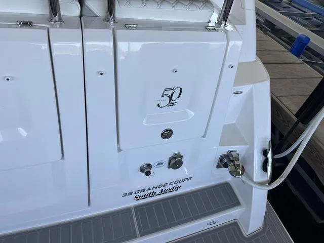 Slide: The Image of Rear view of 2021 Regal 38 Grande Coupe with anniversary logo. - 15