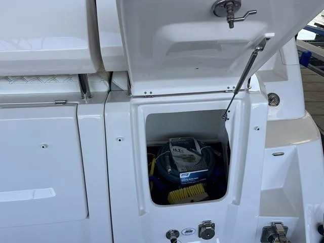 Slide: The Image of Storage compartment in 2021 Regal 38 Grande Coupe boat. - 16