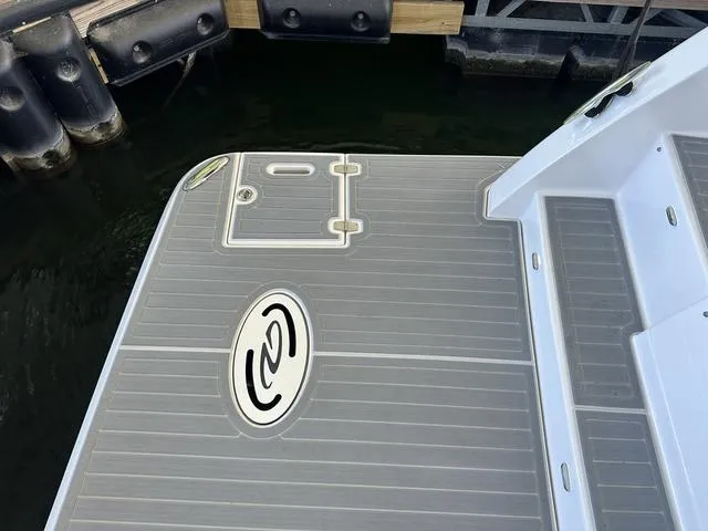 Slide: The Image of Stern platform of 2021 Regal 38 Grande Coupe at dock. - 17