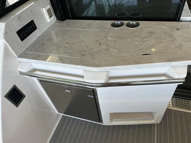 Slide: The Image of Regal 38 Grande Coupe 2021 kitchenette with gray countertop. - 25