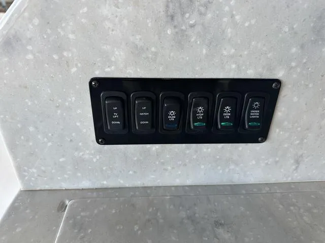Slide: The Image of Switch panel on Regal 38 Grande Coupe 2021 boat. - 29