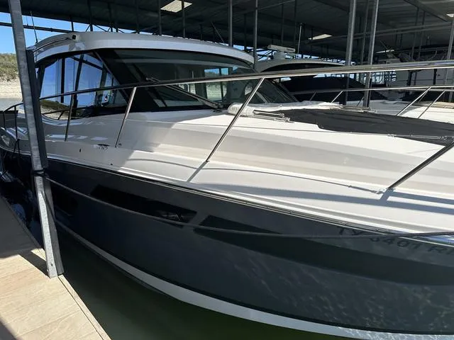 Slide: The Image of 2021 Regal 38 Grande Coupe in a covered dock. - 3
