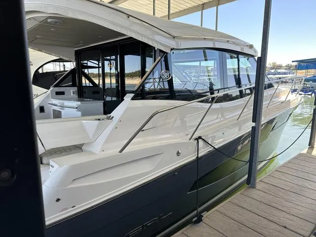 Slide: The Image of 2021 Regal 38 Grande Coupe yacht docked at marina. - 4