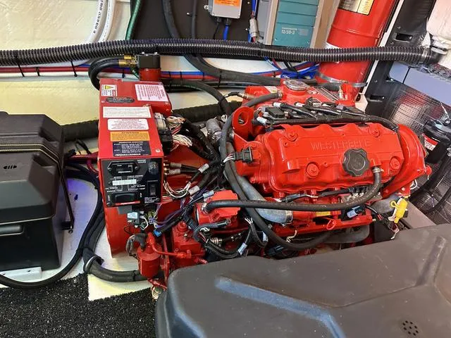 Slide: The Image of Engine room of a 2021 Regal 38 Grande Coupe boat. - 41