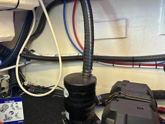 Slide: The Image of Engine room of 2021 Regal 38 Grande Coupe with hoses and wiring. - 44