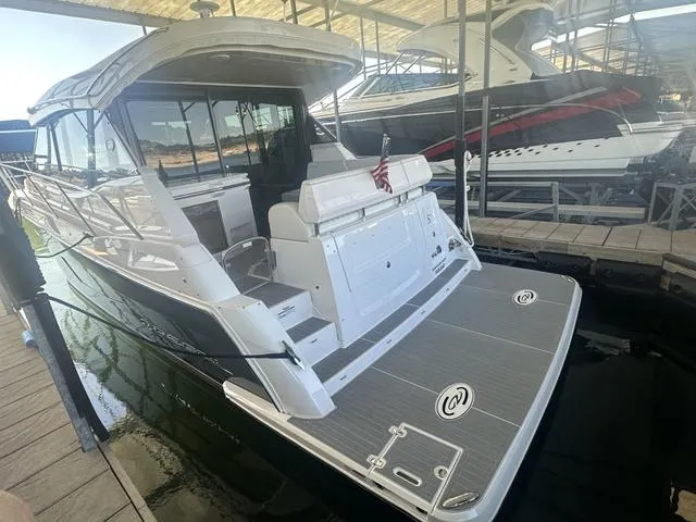 Slide: The Image of 2021 Regal 38 Grande Coupe docked, luxury motor yacht. - 7