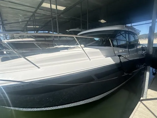Slide: The Image of 2021 Regal 38 Grande Coupe in covered marina area. - 8