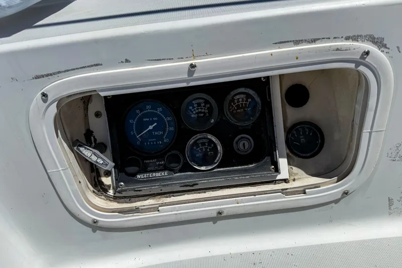 Slide: The Image of Control panel of a 1988 Oday 40 sailboat with gauges and switches. - 13