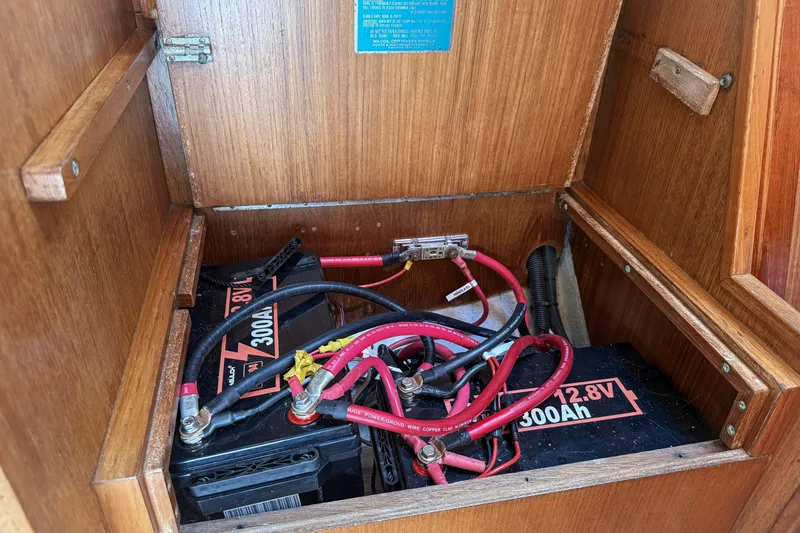 Slide: The Image of Battery compartment of a 1988 Oday 40 sailboat with wiring and connections. - 17