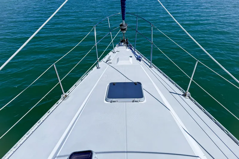 Slide: The Image of Bow view of 1988 Oday 40 sailboat on calm blue water. - 9