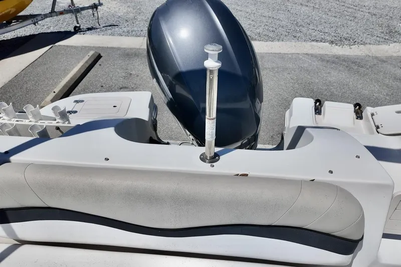 Slide: The Image of 2016 Starcraft 2000 Sportstar boat with outboard motor and seating area. - 13