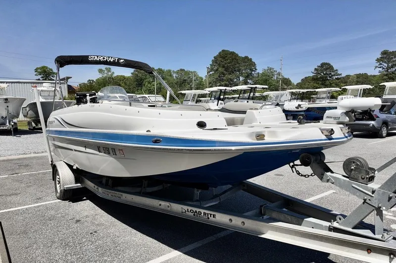 Slide: The Image of 2016 Starcraft 2000 Sportstar boat on trailer in parking lot, sunny day. - 4