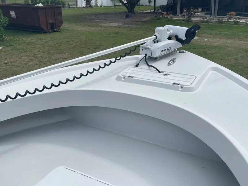 Slide: The Image of Parker 25SE boat 2022 with Minn Kota motor on grass. - 31