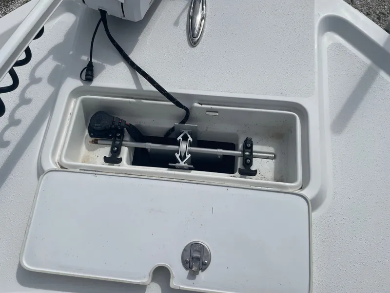 Slide: The Image of Parker 25SE 2022 boat compartment with anchor storage. - 32