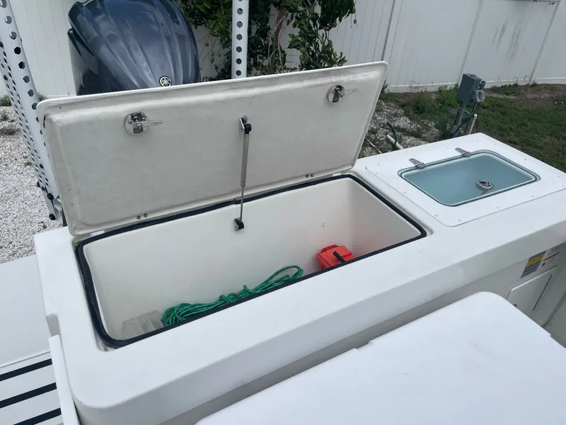 Slide: The Image of Open storage compartment on Parker 25SE boat, year 2022. - 43