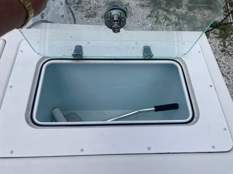 Slide: The Image of Open storage compartment on a 2022 Parker 25SE boat. - 44
