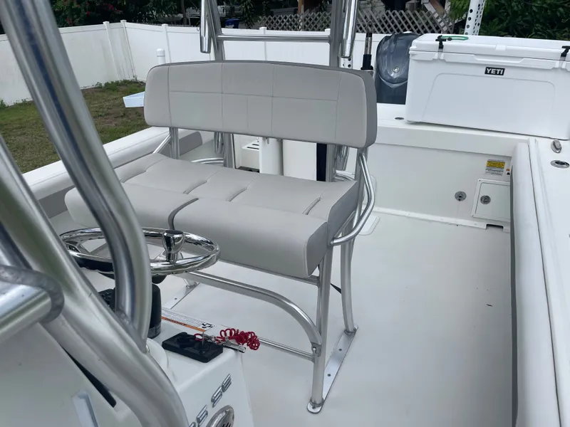 Slide: The Image of Interior of a 2022 Parker 25SE boat with helm and seating area. - 47