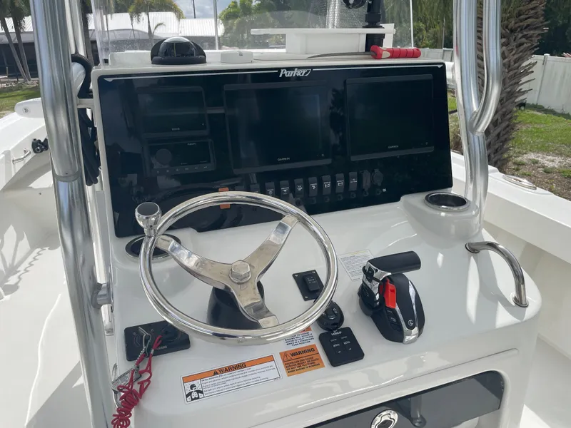 Slide: The Image of Control console of a 2022 Parker 25SE boat. - 49