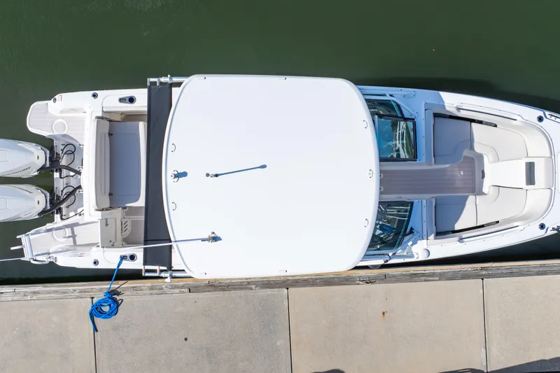 Slide: The Image of Overhead view of a 2019 Boston Whaler 270 Vantage docked, showcasing sleek design and dual engines. - 11