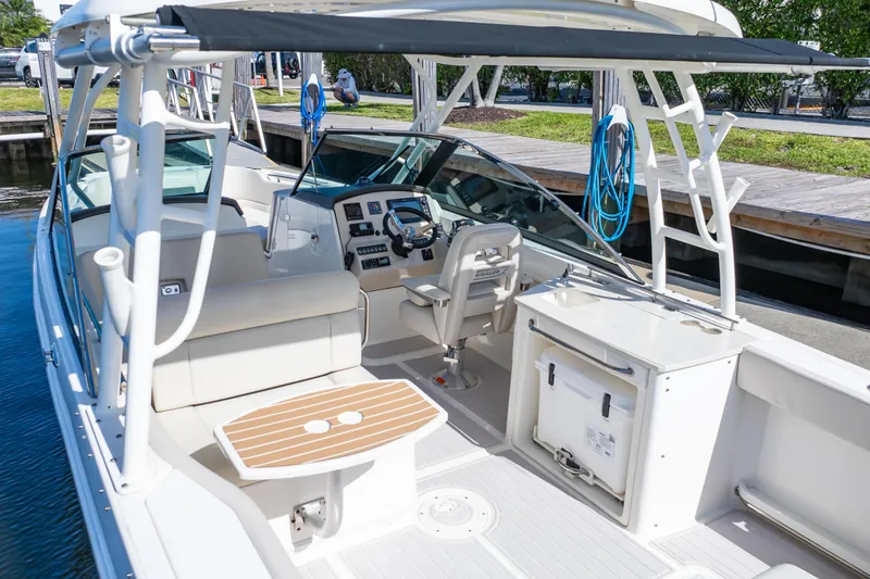 Slide: The Image of 2019 Boston Whaler 270 Vantage boat interior with helm, seating, and storage. - 21