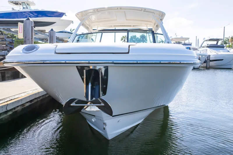 Slide: The Image of 2019 Boston Whaler 270 Vantage boat docked at marina, front view. - 23