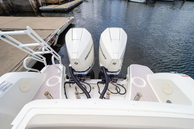 Slide: The Image of 2019 Boston Whaler 270 Vantage with dual Mercury outboard engines at dock. - 26